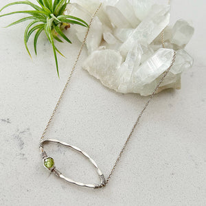 In Orbit Necklace with Peridot and Sterling Silver  by Justicia Artisan Jewelry