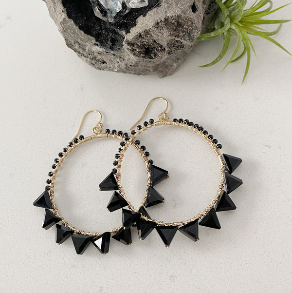 black hoops earrings by Justicia
