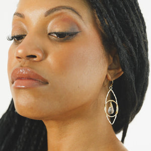 Custom healing Quantum Leap Earrings from Justicia Jewelry on model