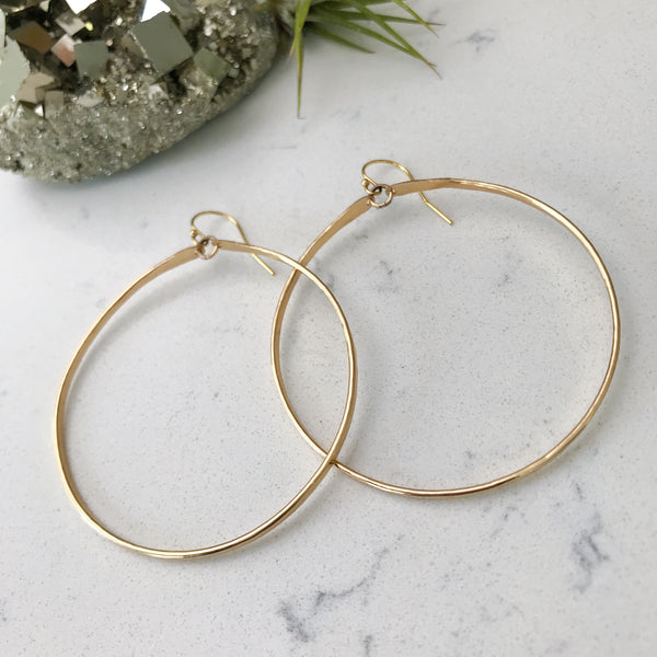 Custom healing hoop earrings from Justicia Jewelry