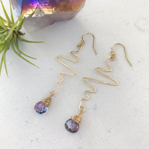 Custom healing heartbeat earrings from Justicia Jewelry with alexandrite