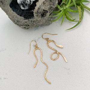 Custom healing serpent earrings from Justicia Jewelry