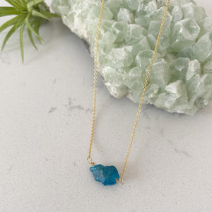 Custom healing motivator necklace from Justicia Jewelry with blue apatite