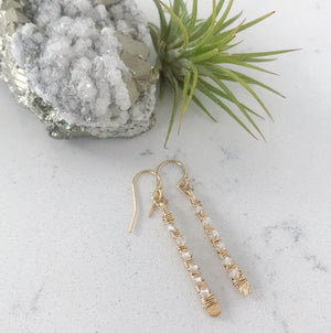 Custom healing pillar of light earrings from Justicia Jewelry with crystal quartz