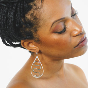 Custom healing Medusa Goddess earrings from Justicia Jewelry on model