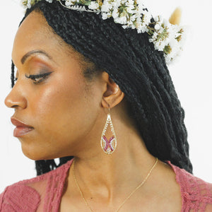 Custom healing Venus Goddess Earrings from Justicia Jewelry on model